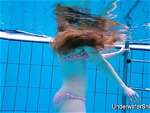 stunning gal shows fantastic figure underwater